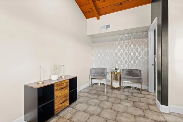 a view of a house with backyard and porch