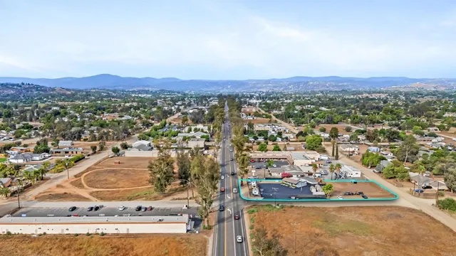 an aerial view of residential house and car parked