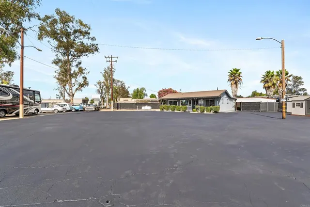 an aerial view of residential house and car parked