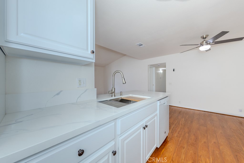 23222 Orange, Unit 4 Lake Forest, CA 92630 - Photo 13 of 35 a kitchen with a sink and cabinets