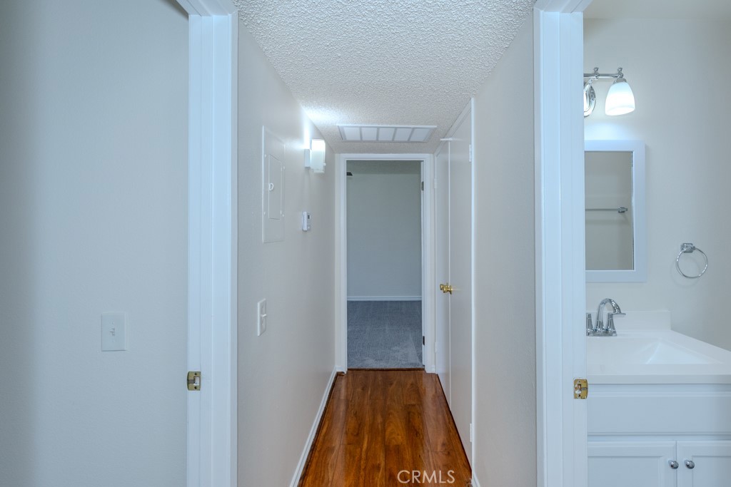 23222 Orange, Unit 4 Lake Forest, CA 92630 - Photo 17 of 35 a view of a bathroom from a hallway
