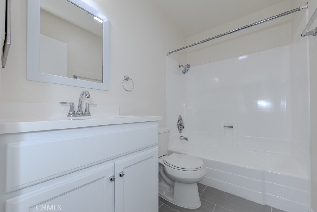 23222 Orange, Unit 4 Lake Forest, CA 92630 - Photo 18 of 35 a bathroom with a sink a toilet and shower