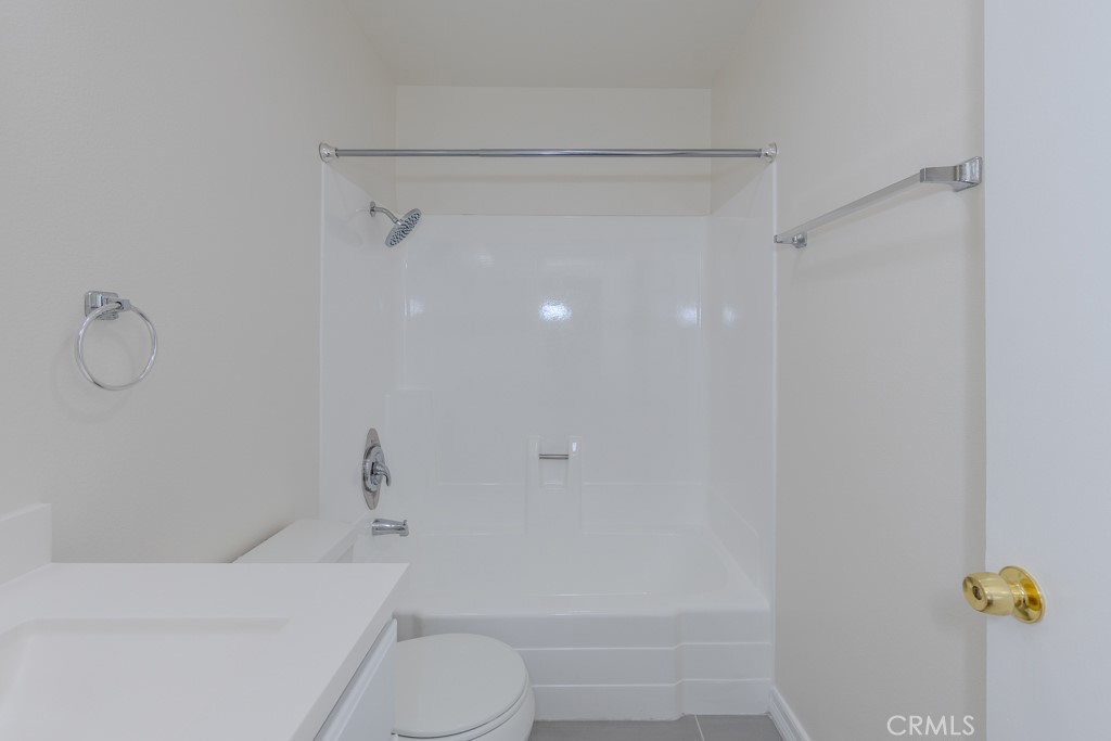 23222 Orange, Unit 4 Lake Forest, CA 92630 - Photo 19 of 35 a bathroom with a shower a toilet and a shower