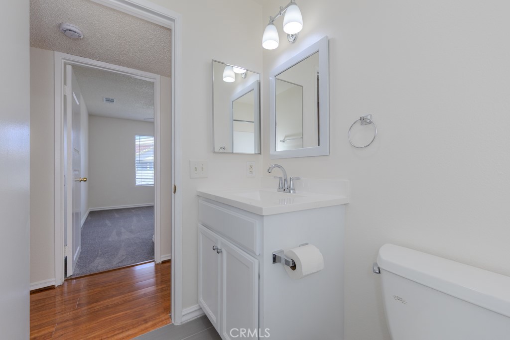 23222 Orange, Unit 4 Lake Forest, CA 92630 - Photo 20 of 35 a bathroom with a sink a toilet and shower