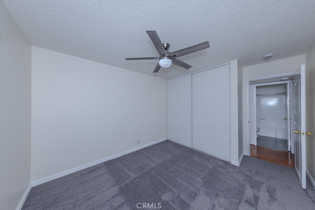 23222 Orange, Unit 4 Lake Forest, CA 92630 - Photo 22 of 35 a view of a livingroom with a ceiling fan and window