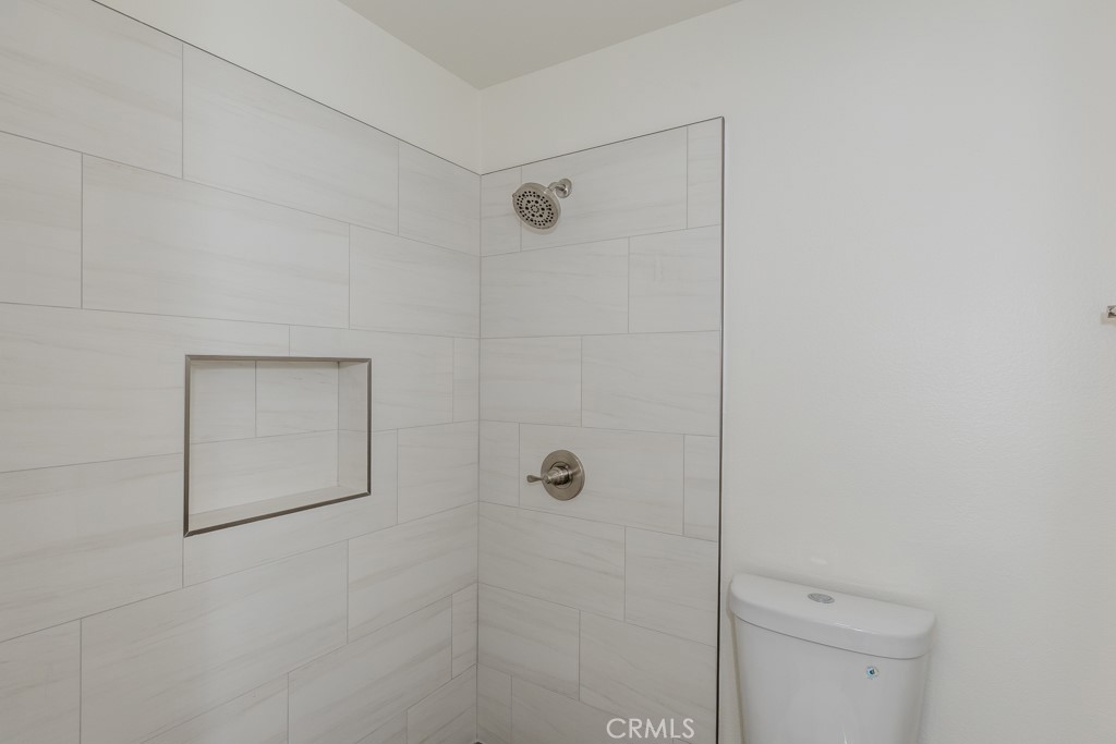 23222 Orange, Unit 4 Lake Forest, CA 92630 - Photo 26 of 35 a bathroom with a shower