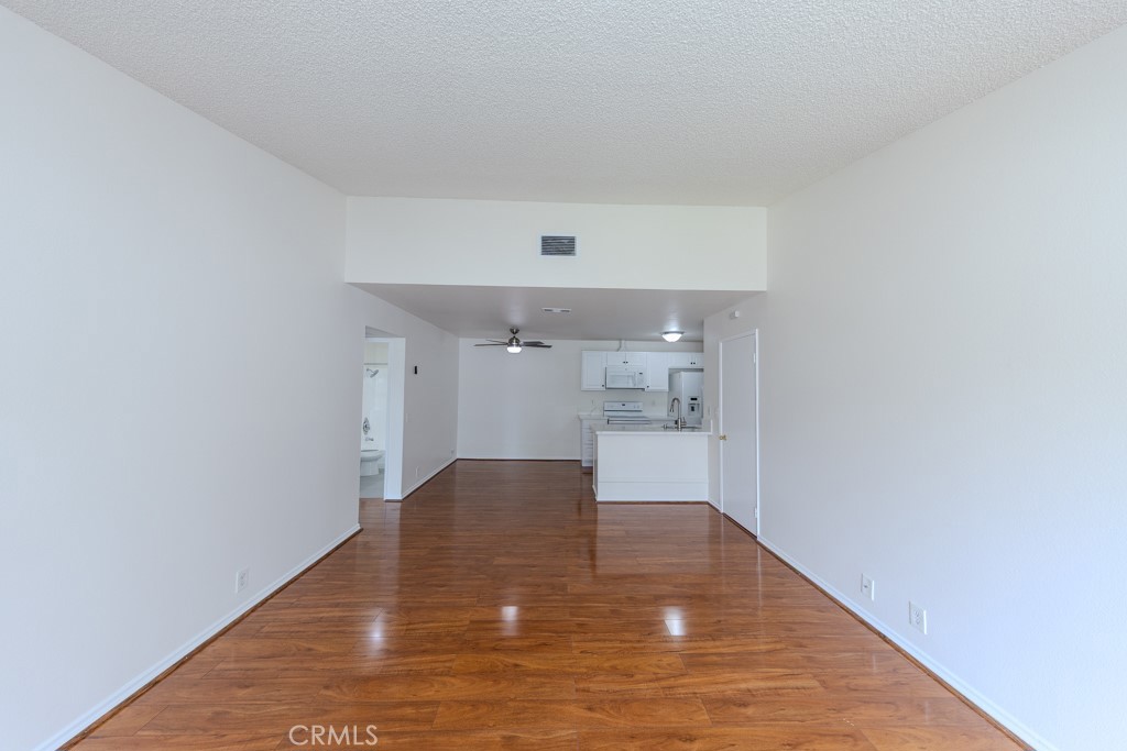 23222 Orange, Unit 4 Lake Forest, CA 92630 - Photo 5 of 35 a view of empty room with wooden floor