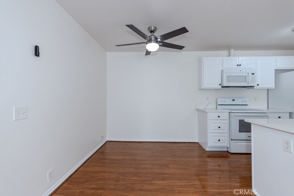23222 Orange, Unit 4 Lake Forest, CA 92630 - Photo 8 of 35 a view of kitchen with wooden floor and window