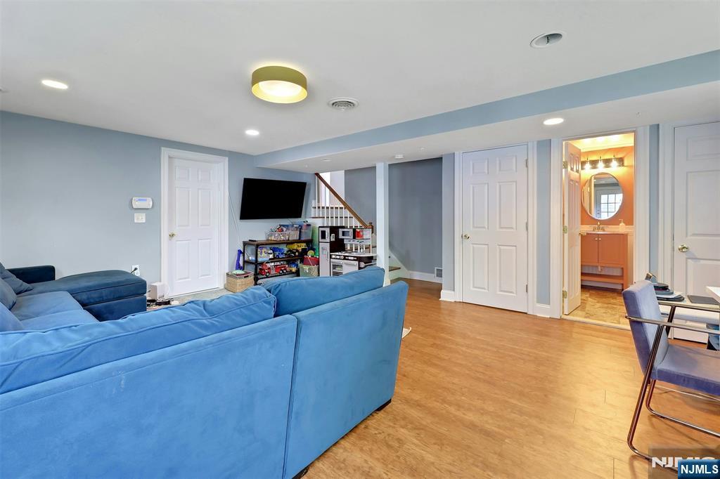 514 Rutland Avenue Teaneck, NJ 07666 - Photo 24 of 40 a living room with furniture and a flat screen tv
