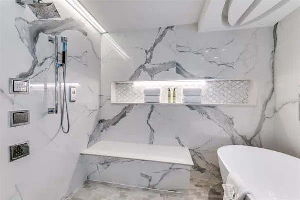 a bathroom with a toilet sink and shower