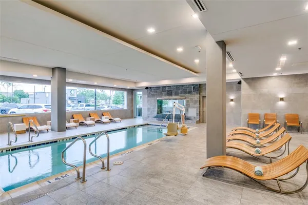 a room with lots of table chair and view of living room