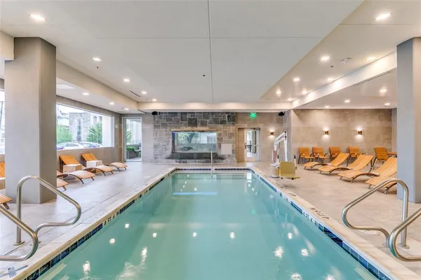 a bathroom with a large tub and shower