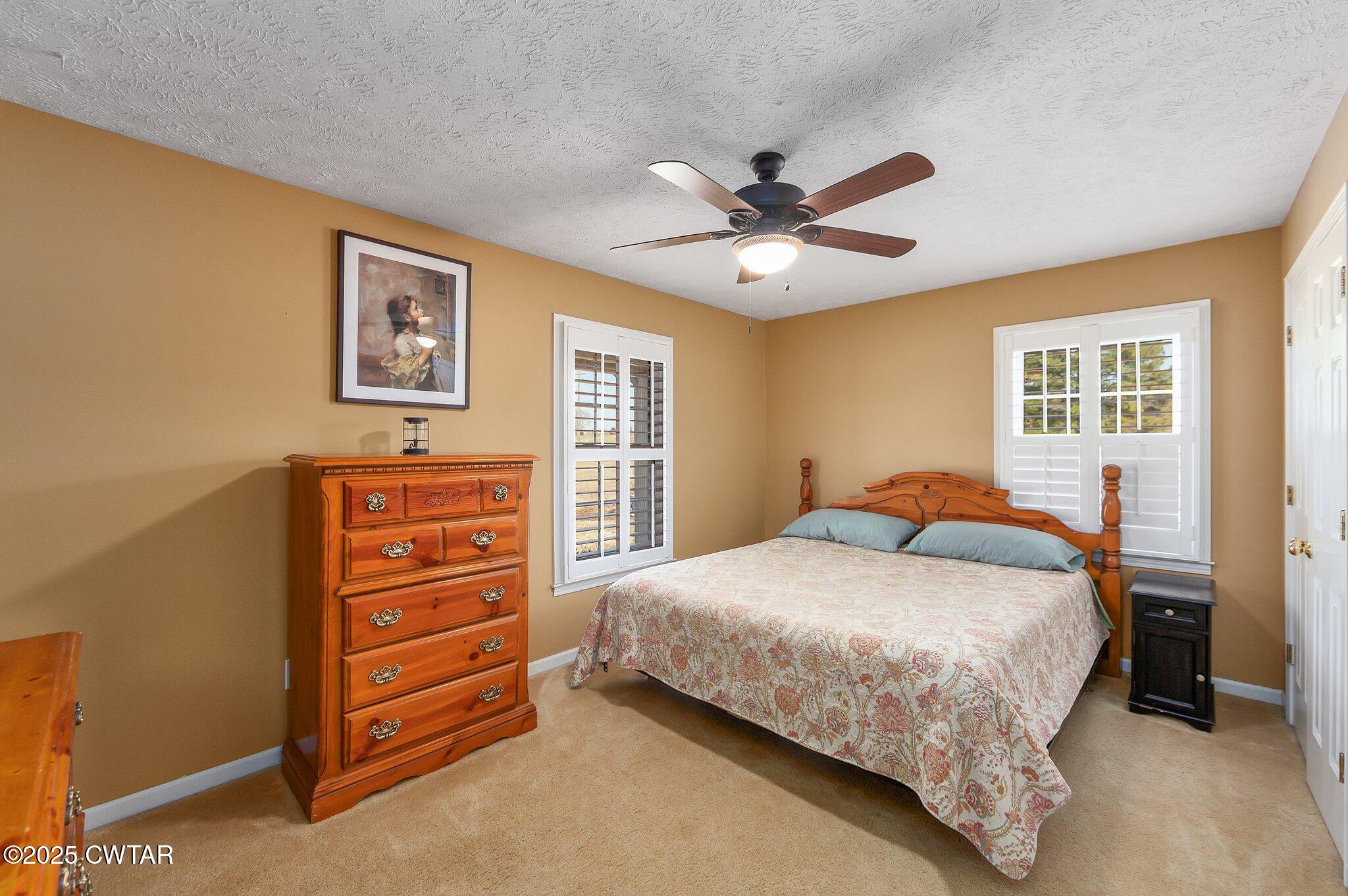 280 St Road Beech Bluff, TN 38313 - Photo 14 of 46 a bedroom with a bed a dresser and a window