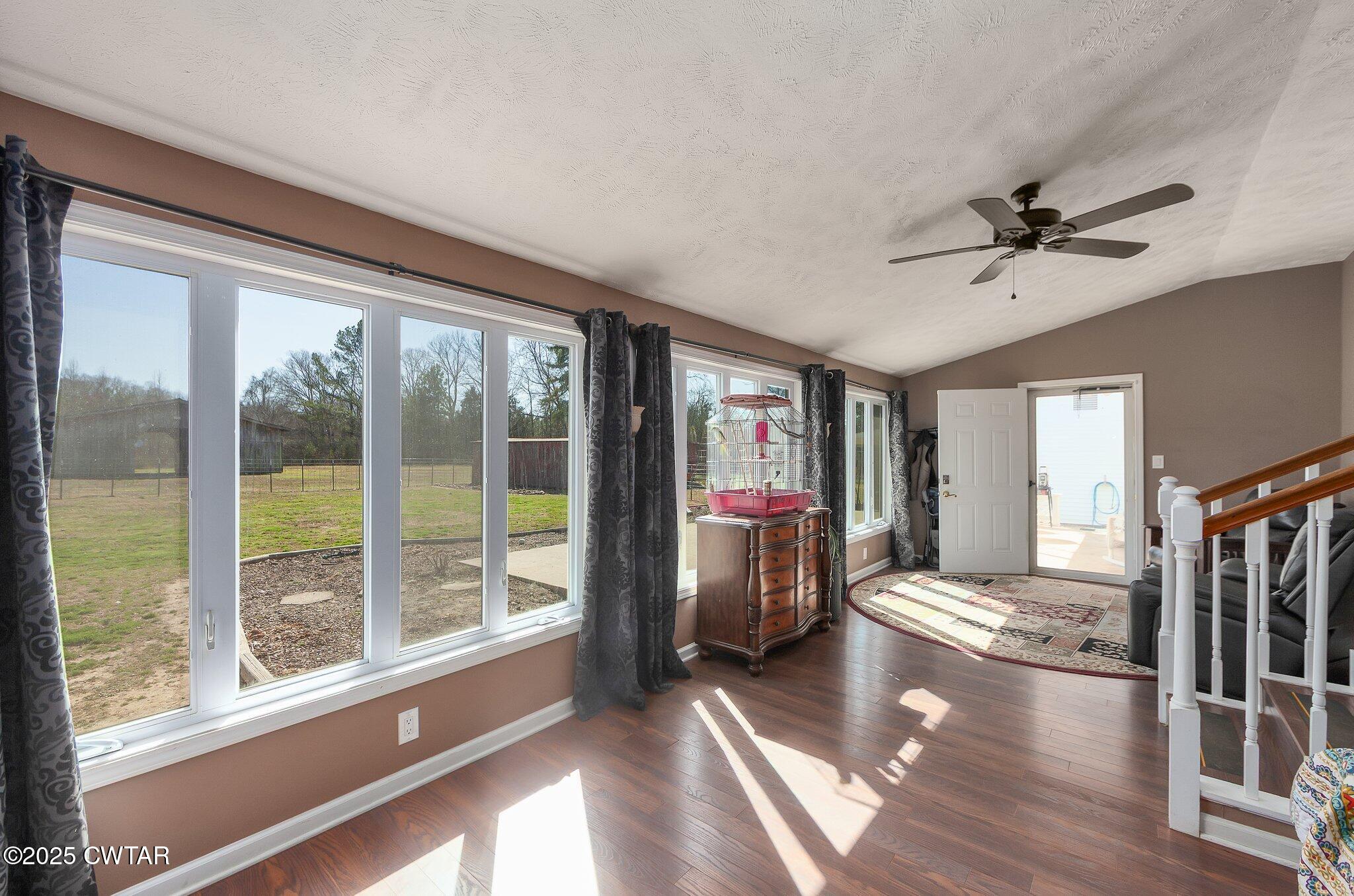 280 St Road Beech Bluff, TN 38313 - Photo 20 of 46 a living room with fireplace furniture and a floor to ceiling window