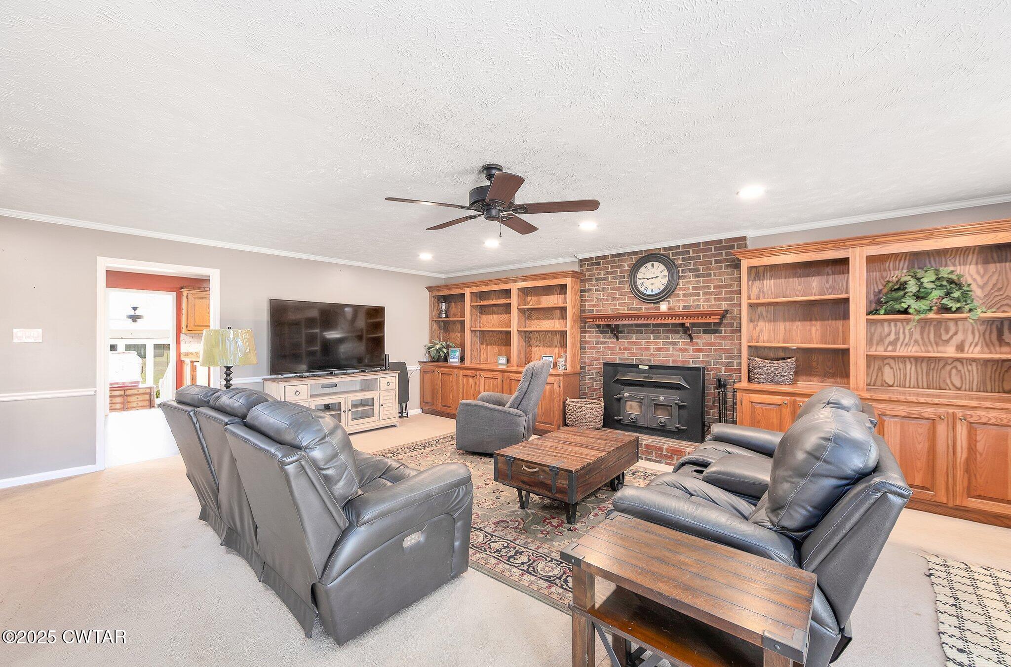 280 St Road Beech Bluff, TN 38313 - Photo 2 of 46 a living room with furniture flat screen tv and a fireplace