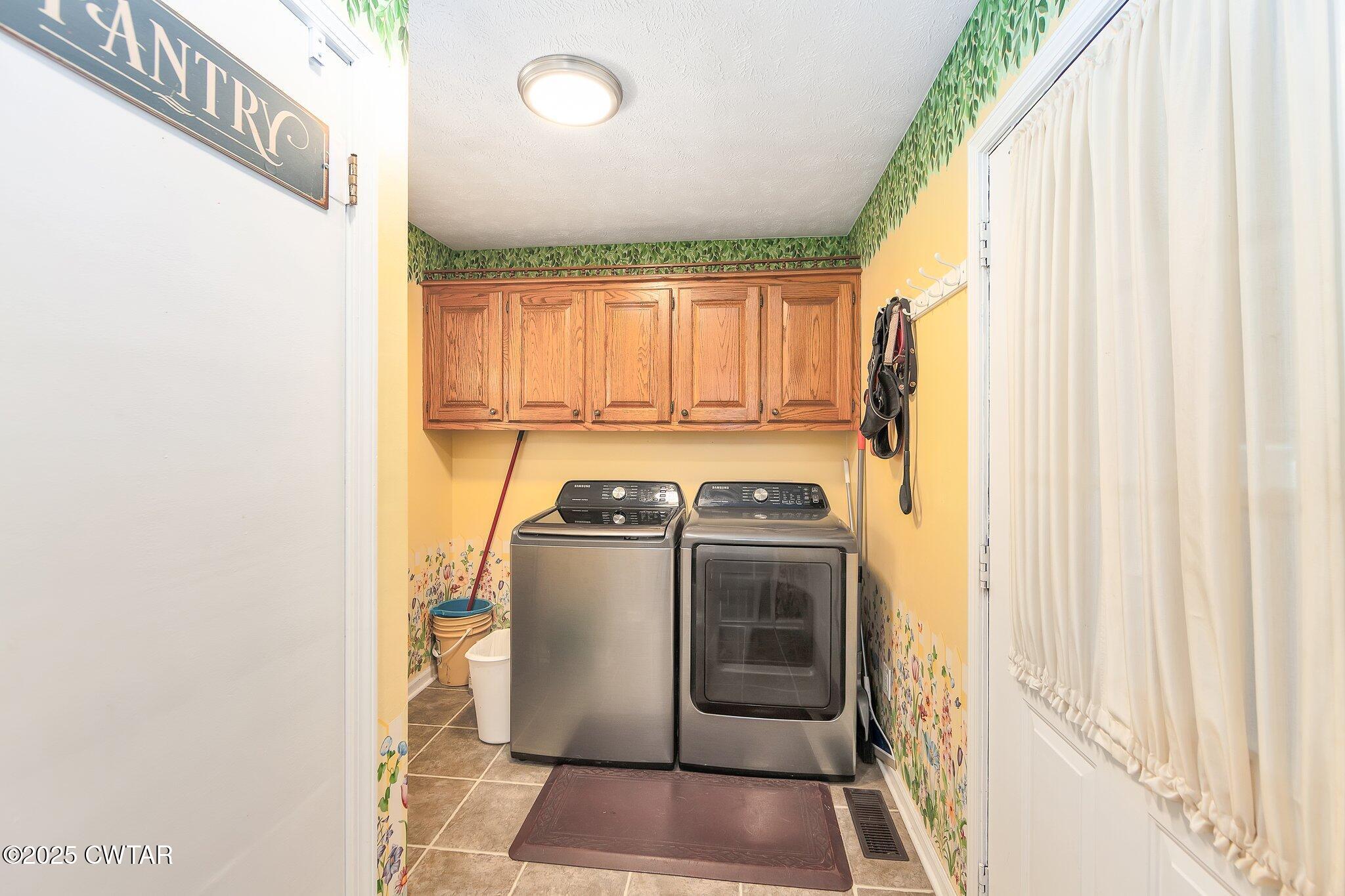 280 St Road Beech Bluff, TN 38313 - Photo 22 of 46 a utility room with dryer and washer