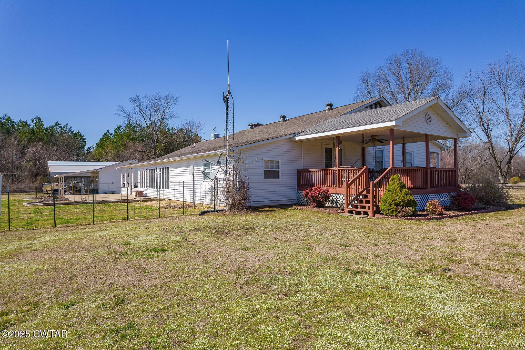 280 St Road Beech Bluff, TN 38313 - Photo 27 of 46 a view of a house with a yard and sitting area