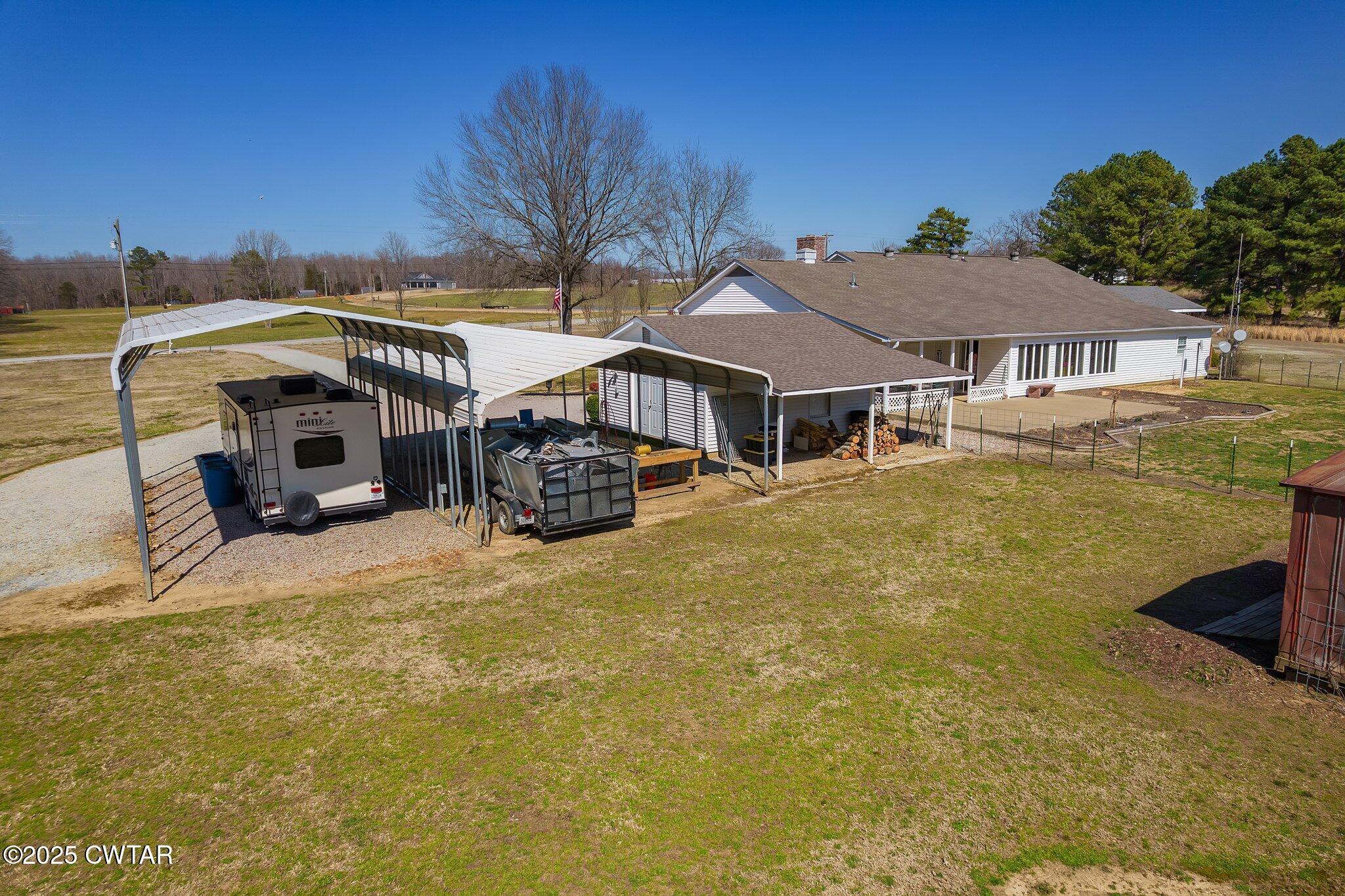 280 St Road Beech Bluff, TN 38313 - Photo 28 of 46 a house with swimming pool in front of it
