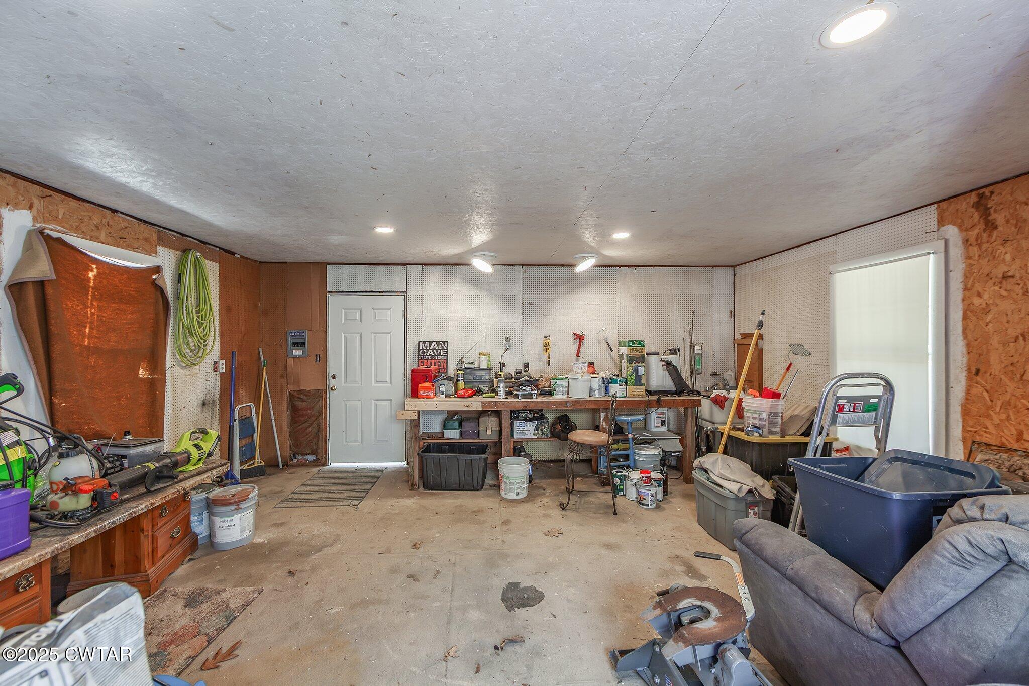 280 St Road Beech Bluff, TN 38313 - Photo 30 of 46 a living room with furniture and a flat screen tv