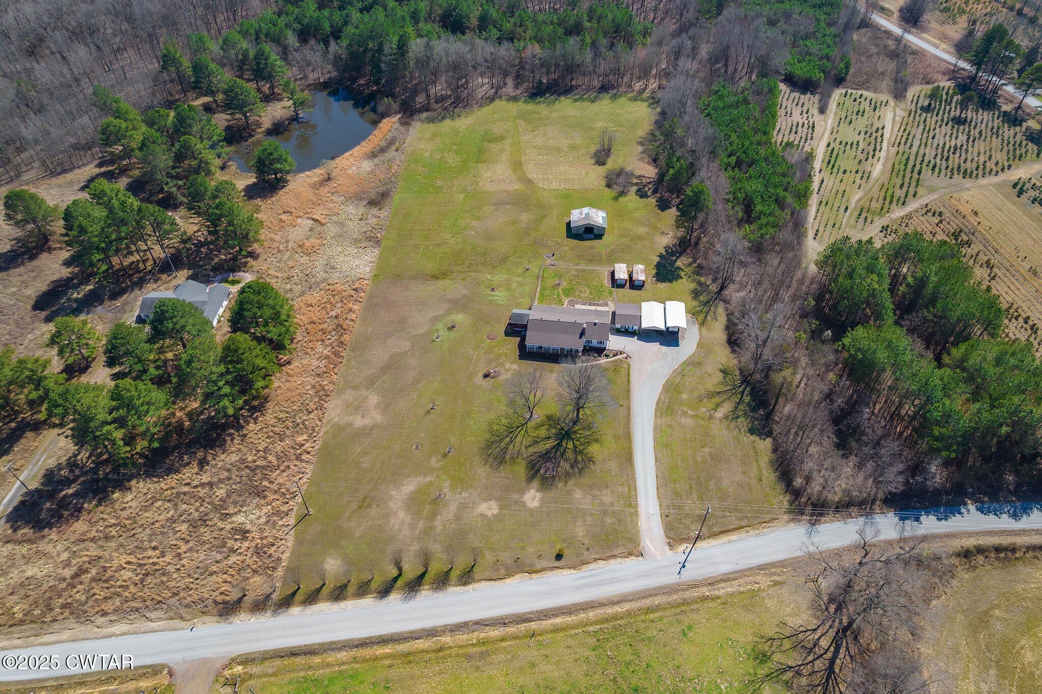 280 St Road Beech Bluff, TN 38313 - Photo 35 of 46 an aerial view of a house with a swimming pool