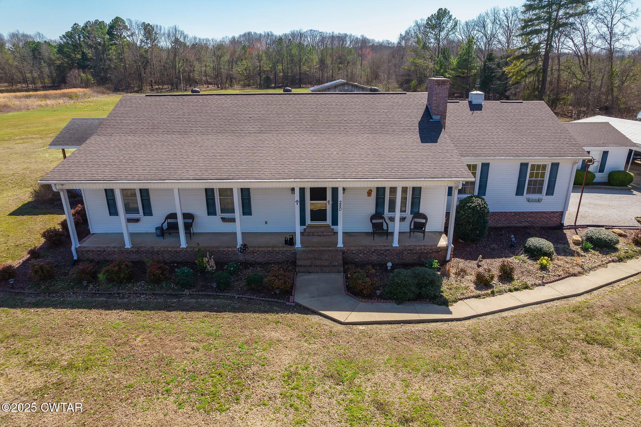 280 St Road Beech Bluff, TN 38313 - Photo 42 of 46 a aerial view of a house with swimming pool and a yard
