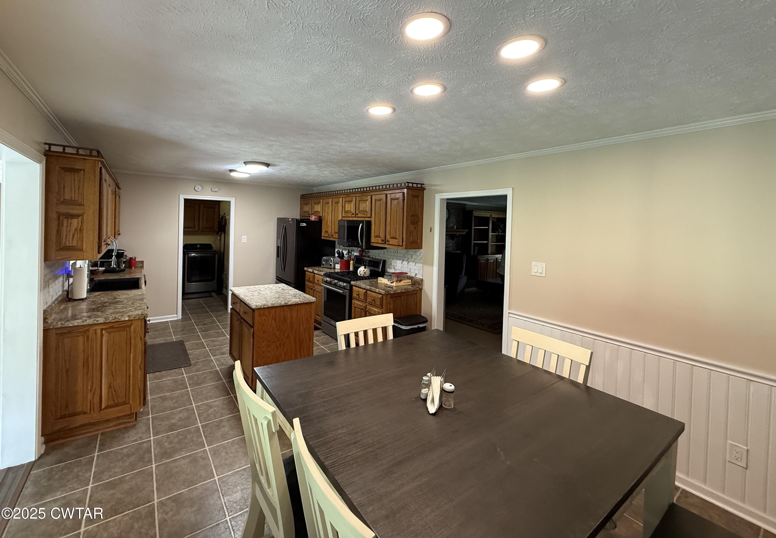 280 St Road Beech Bluff, TN 38313 - Photo 8 of 46 a living room with furniture a flat screen tv and kitchen view