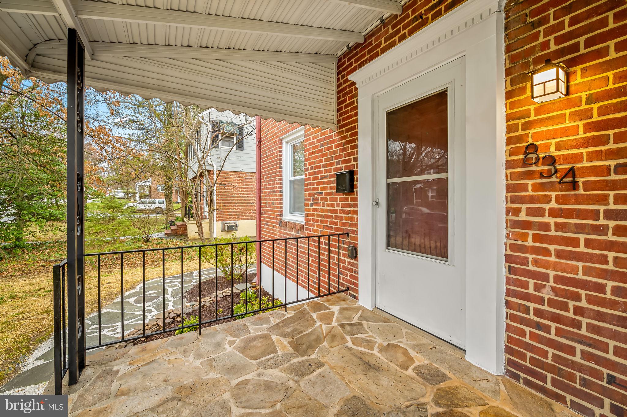 834 Evesham Avenue Baltimore, MD 21212 - Photo 2 of 37 a view of a balcony with a floor to ceiling window