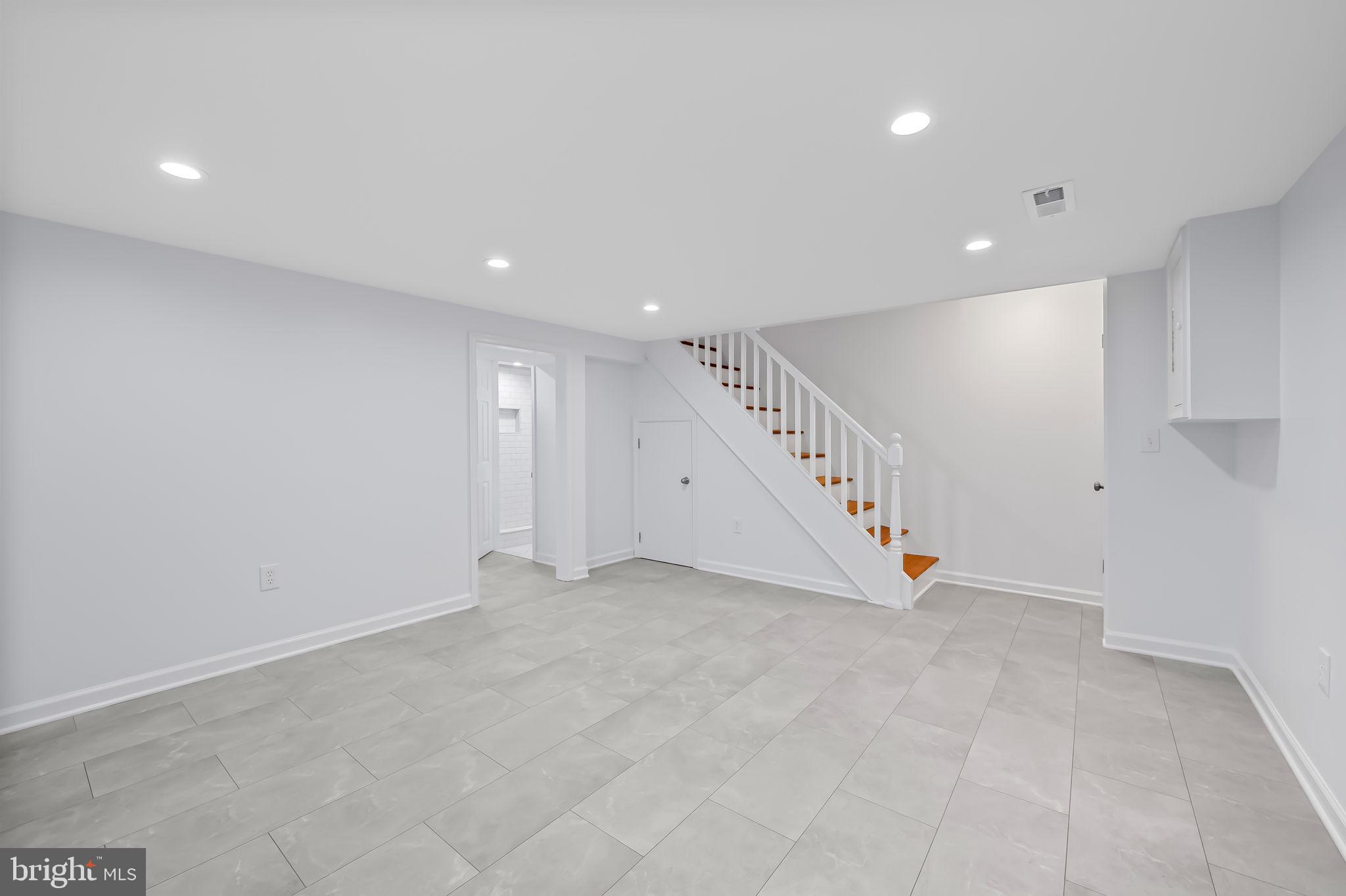 834 Evesham Avenue Baltimore, MD 21212 - Photo 23 of 37 a view of an empty room with stairs