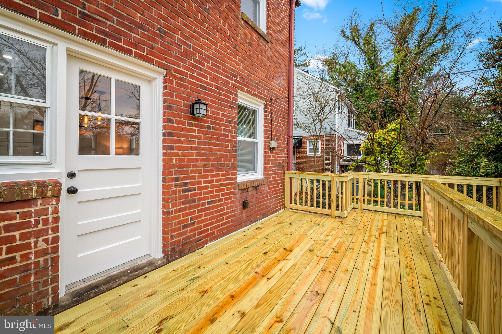 834 Evesham Avenue Baltimore, MD 21212 - Photo 32 of 37 a view of a balcony with wooden floor and fence