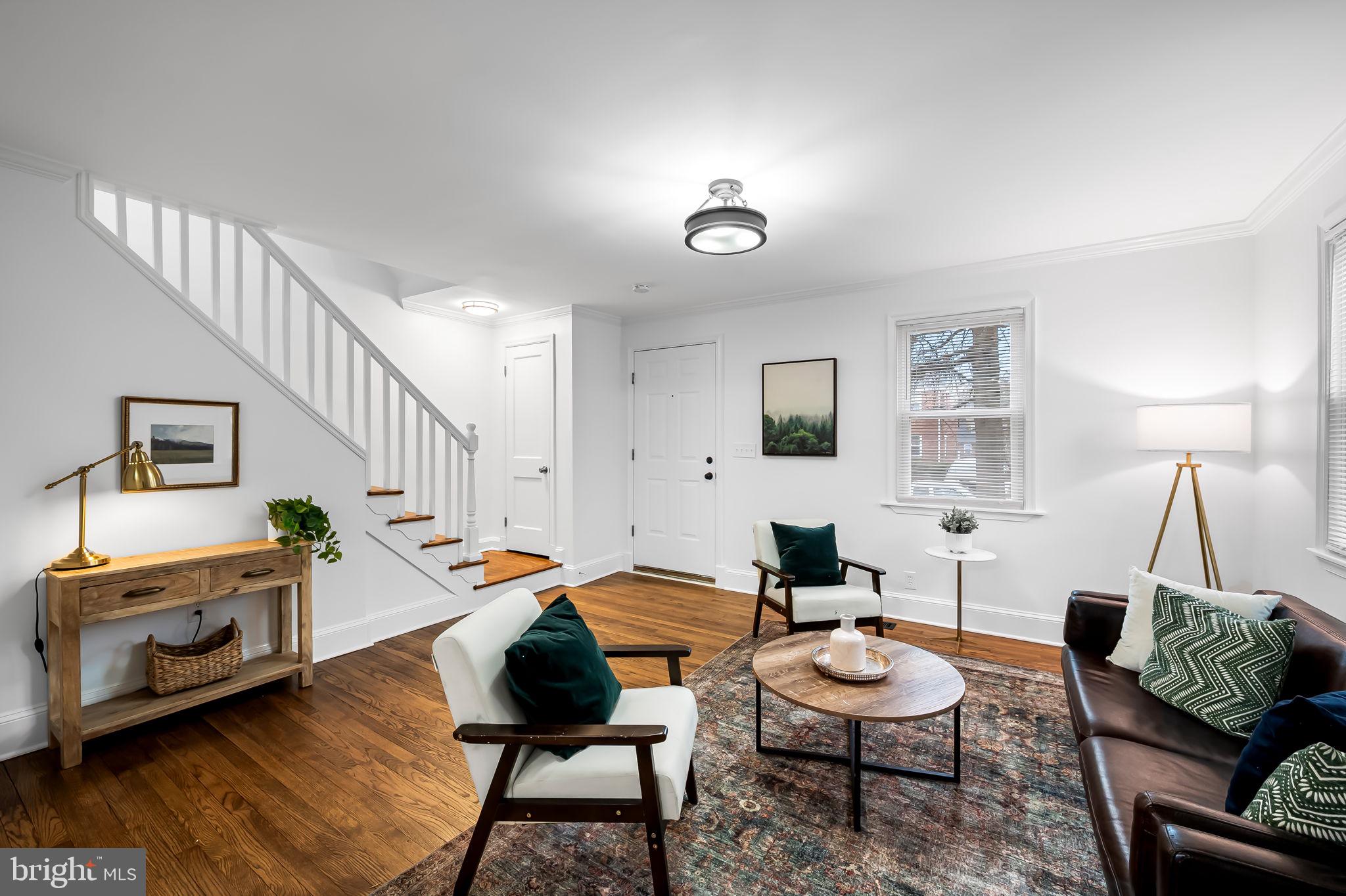 834 Evesham Avenue Baltimore, MD 21212 - Photo 4 of 37 a living room with furniture and wooden floor