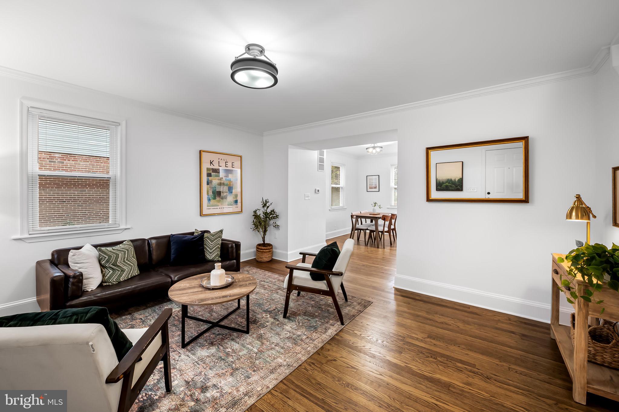 834 Evesham Avenue Baltimore, MD 21212 - Photo 5 of 37 a living room with furniture and wooden floor