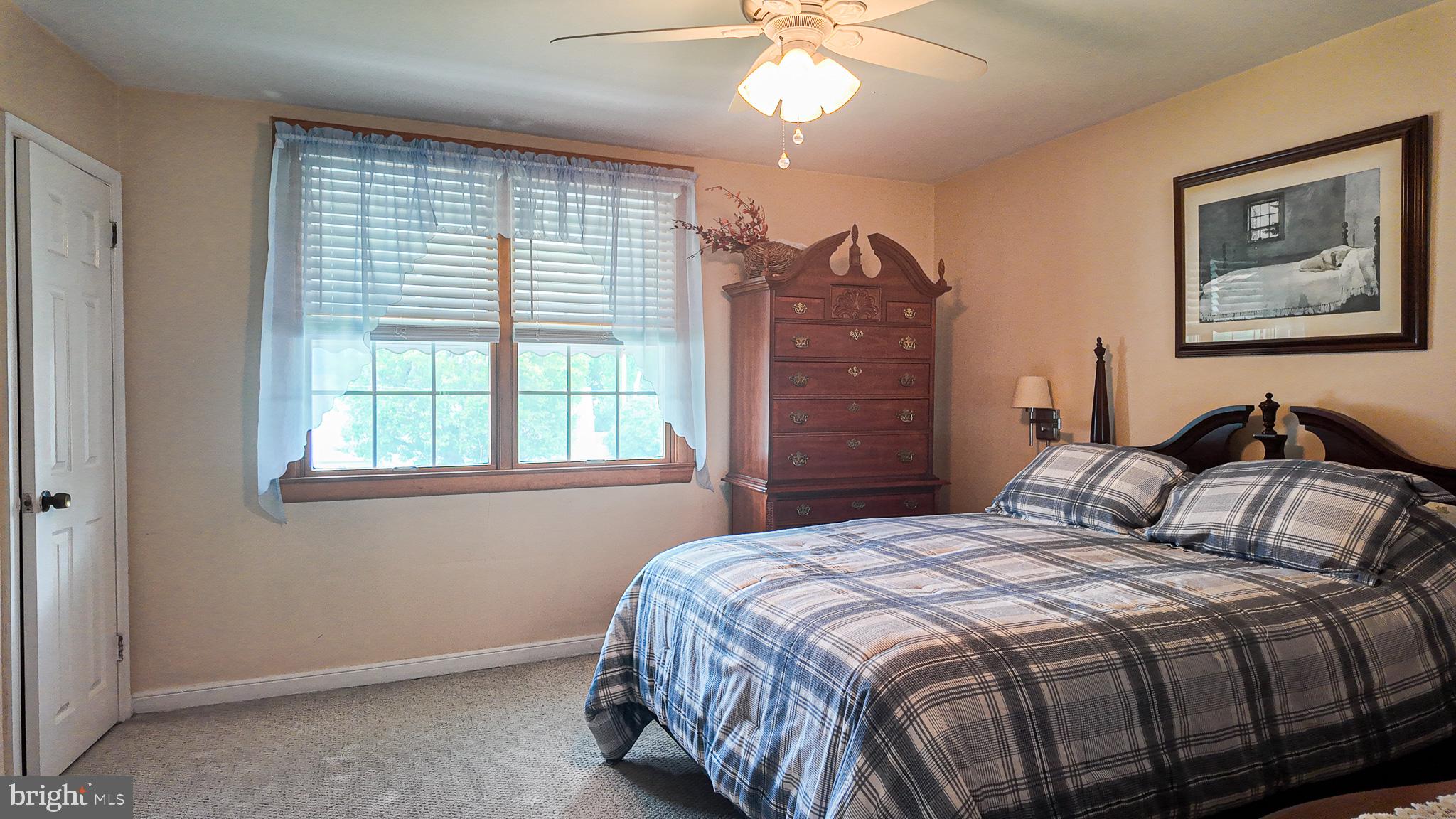 3330 Fordham Road Philadelphia, PA 19114 - Photo 14 of 28 a bedroom with a bed and a chandelier