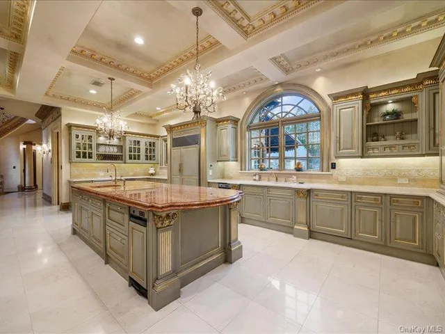 a kitchen with stainless steel appliances granite countertop a sink and cabinets