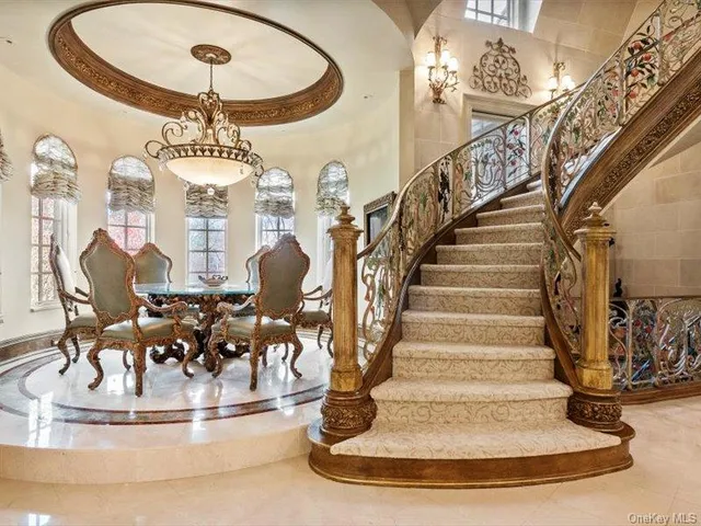 a dining room with furniture and window