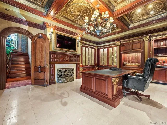 a view of a patio with table and chairs potted plants
