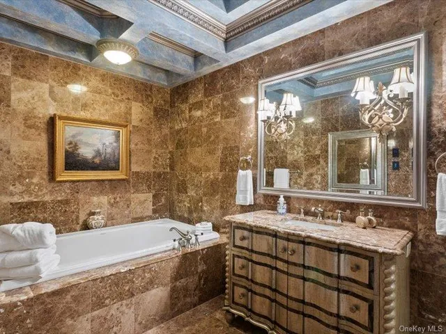 a bathroom with a bathtub and shower