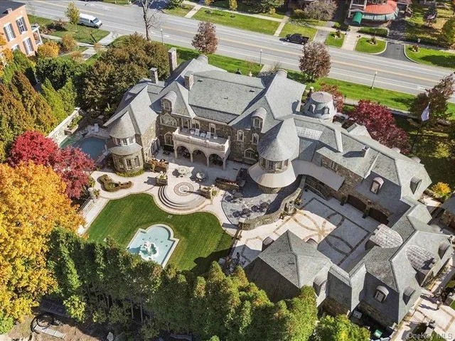 an aerial view of a house with a swimming pool