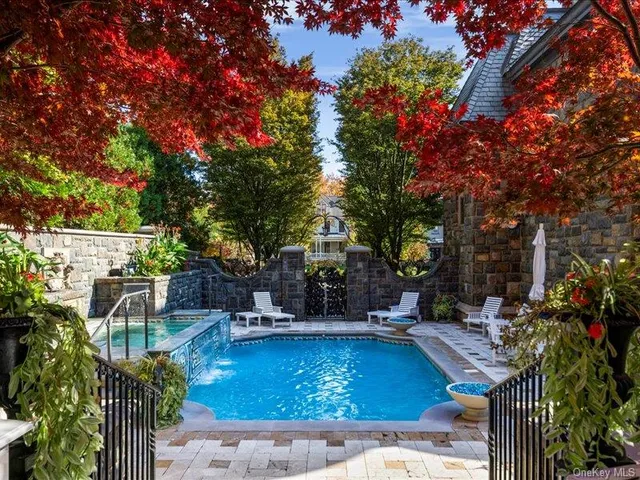 a view of a patio with swimming pool