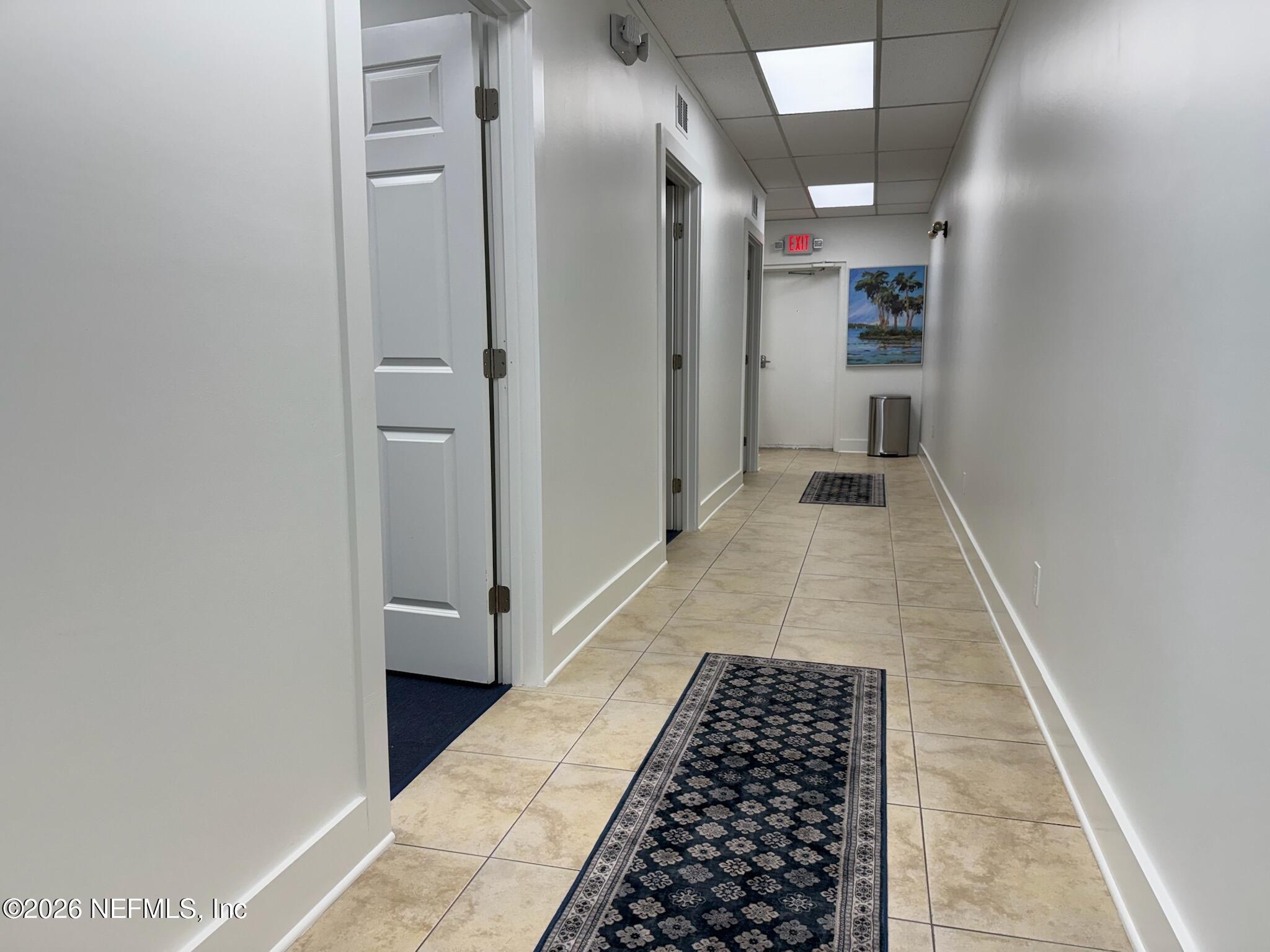 1301 Penman Road, Unit C Jacksonville Beach, FL 32250 - Photo 8 of 14 a walk in closet with wooden floor