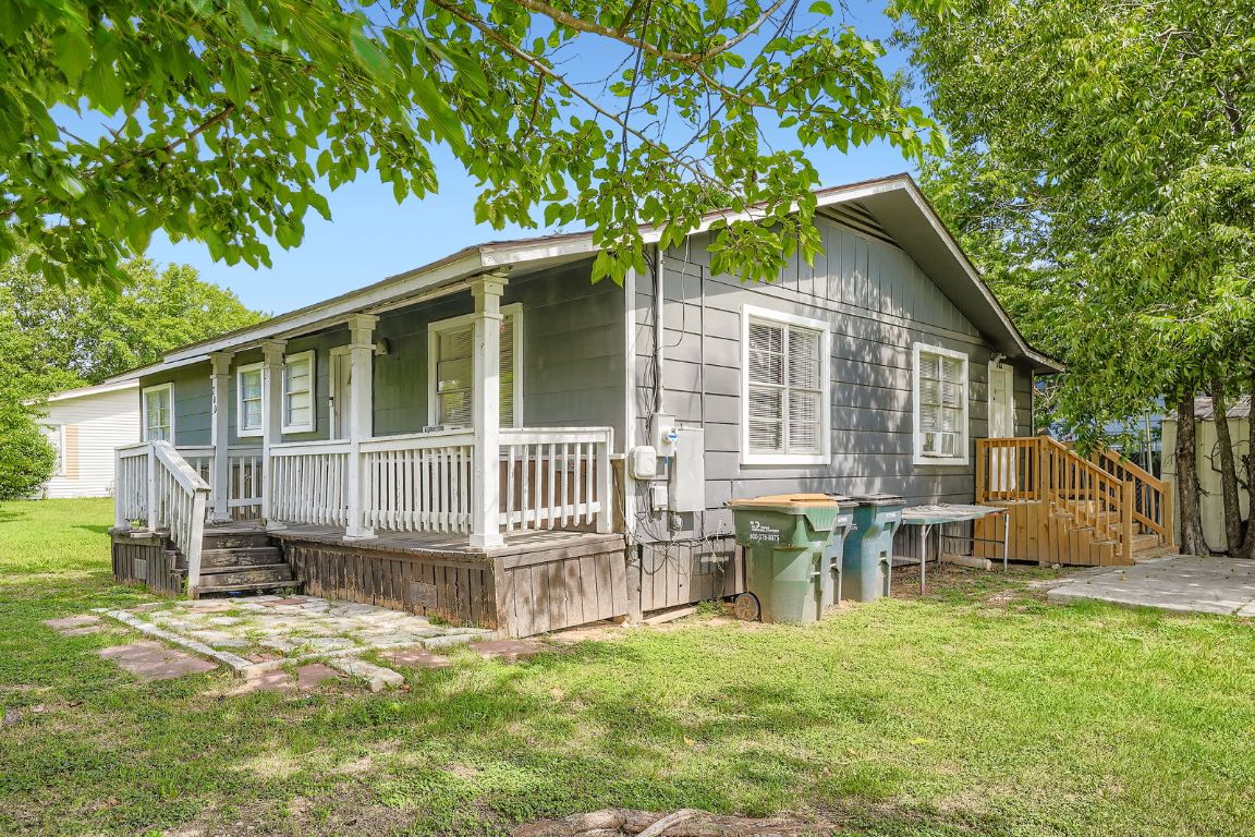 700 Blanco Street Kyle, TX 78640 - Photo 2 of 29 a view of a house with a yard and a deck