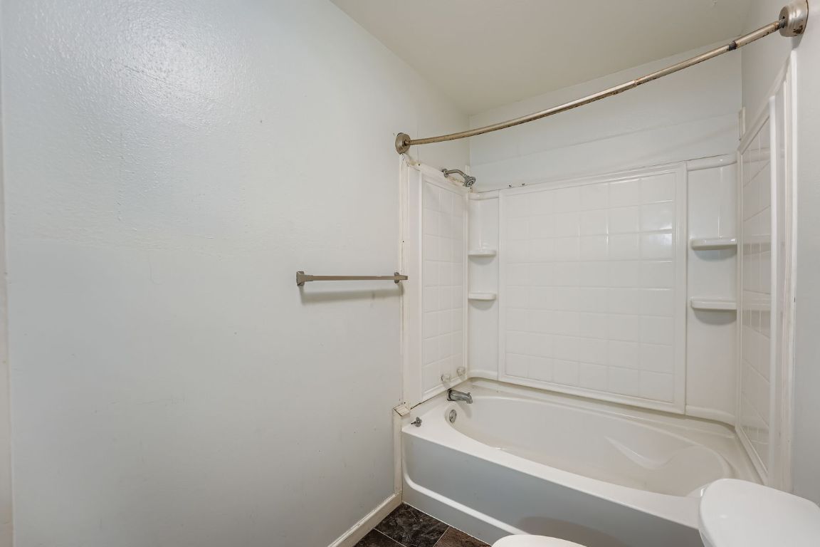 700 Blanco Street Kyle, TX 78640 - Photo 21 of 29 a bathroom with a tub and shower
