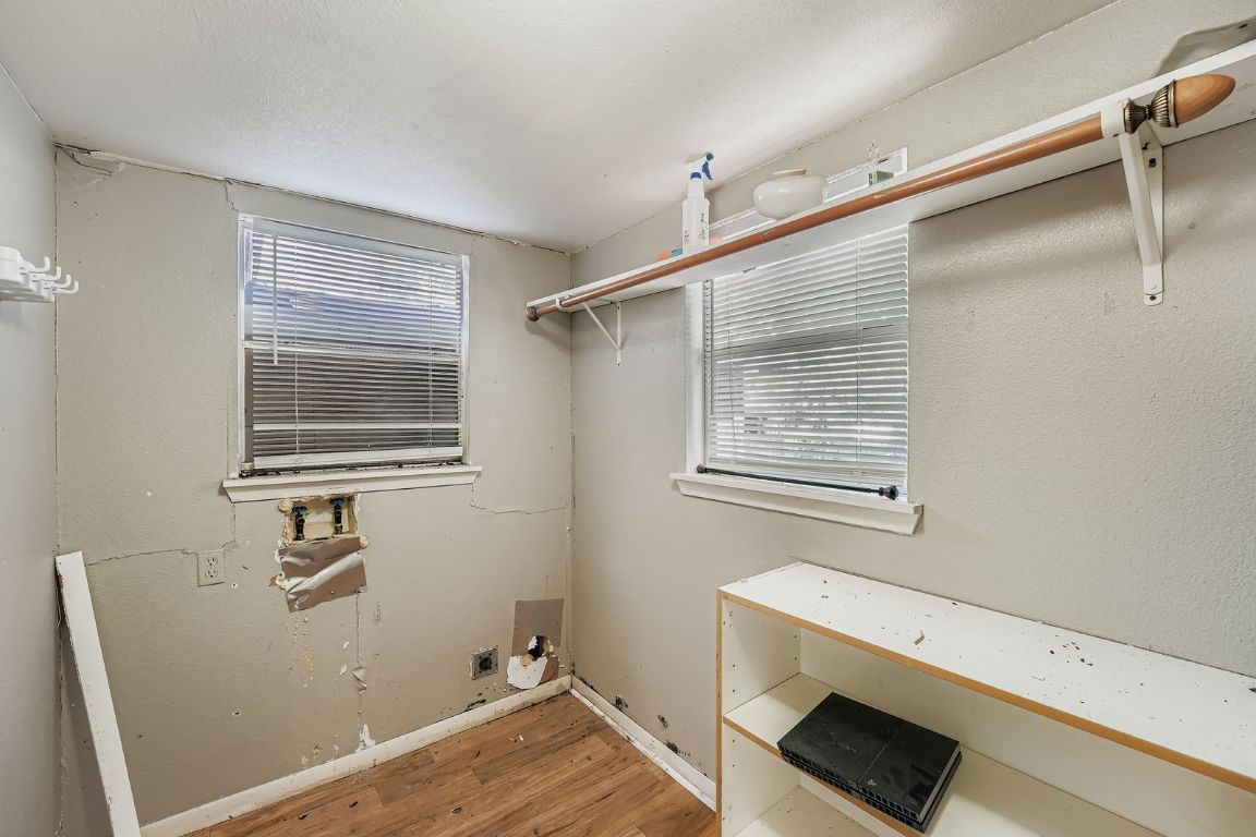 700 Blanco Street Kyle, TX 78640 - Photo 22 of 29 a bathroom with a window sink and shower