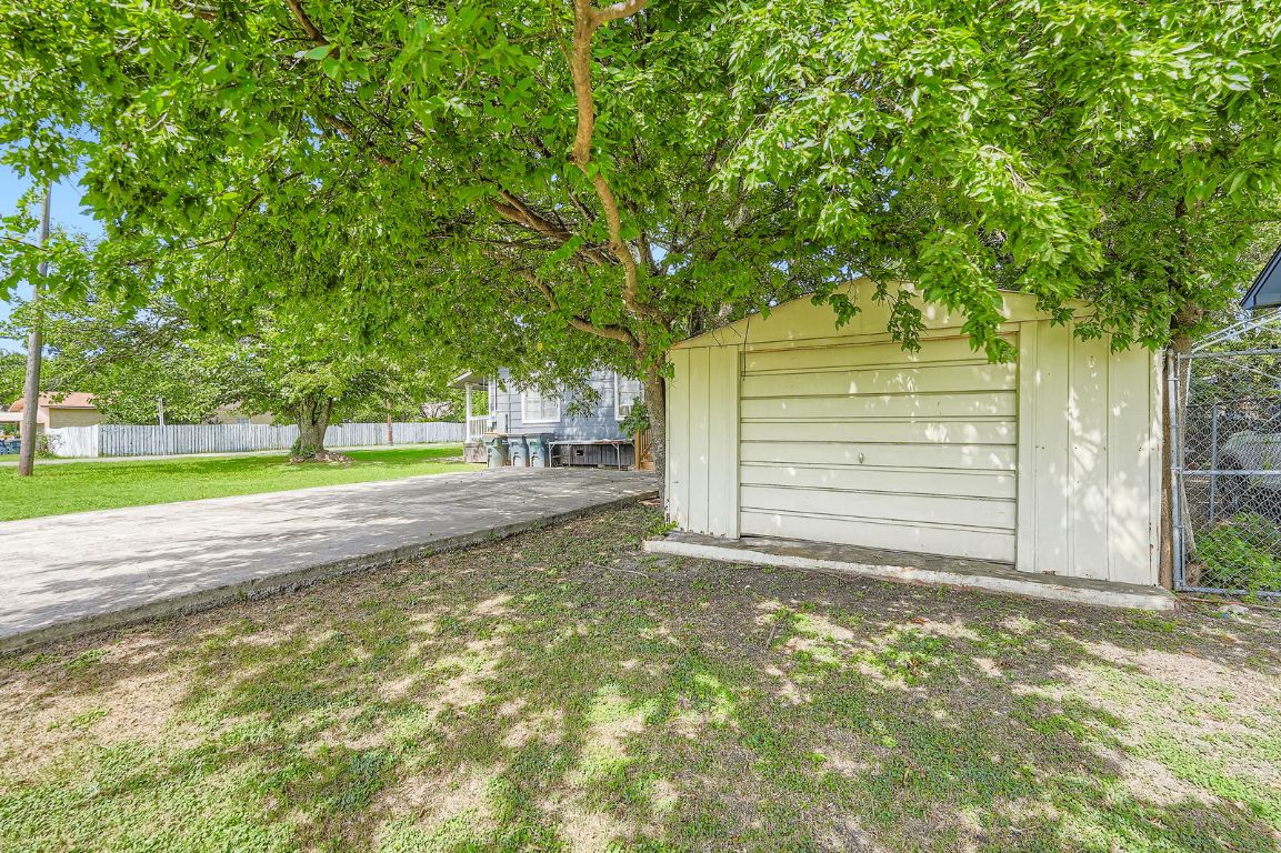 700 Blanco Street Kyle, TX 78640 - Photo 26 of 29 a view of a yard with large tree