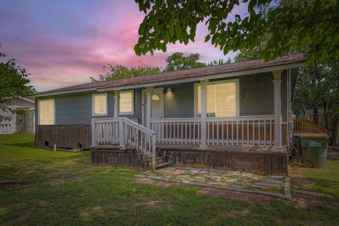 700 Blanco Street Kyle, TX 78640 - Photo 3 of 29 a view of a house with a yard in front of it