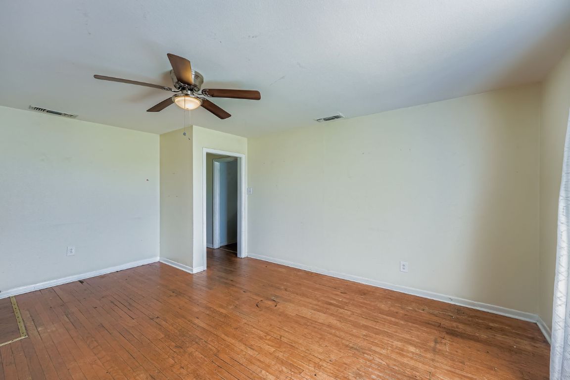 700 Blanco Street Kyle, TX 78640 - Photo 5 of 29 a view of room with wooden floor