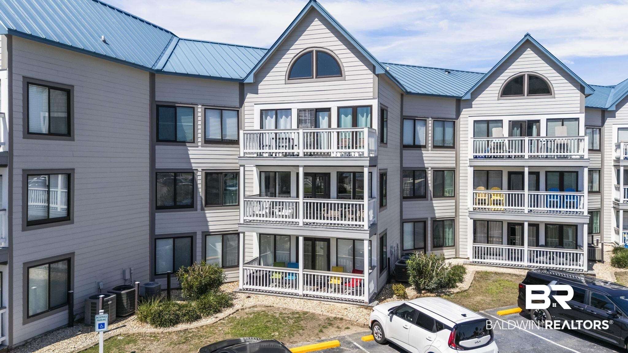 497 Plantation Road, Unit 1247 Gulf Shores, AL 36542 - Photo 1 of 29 View of apartment building / complex featuring uncovered parking