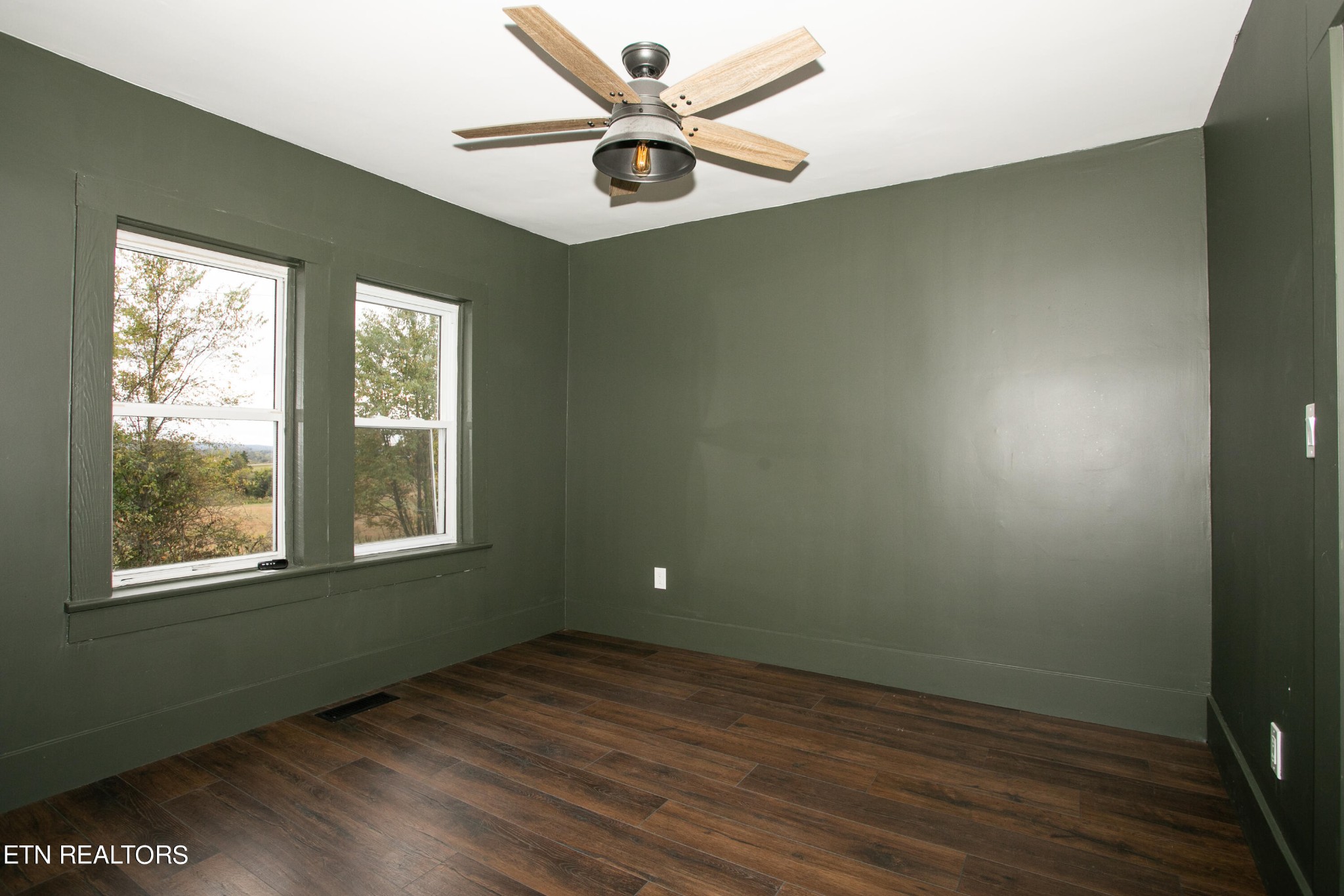 1735 Redwing Lane New Market, TN 37820 - Photo 14 of 33 a view of an empty room with window and wooden floor