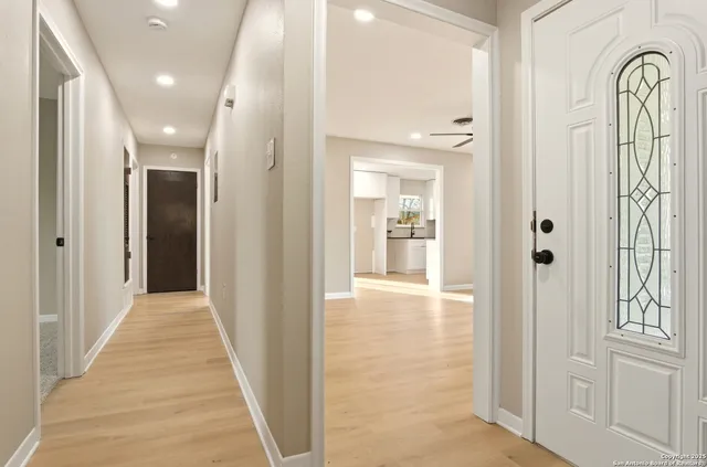 wooden floor with a bathroom