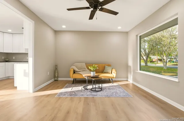 a workspace room with furniture and a window