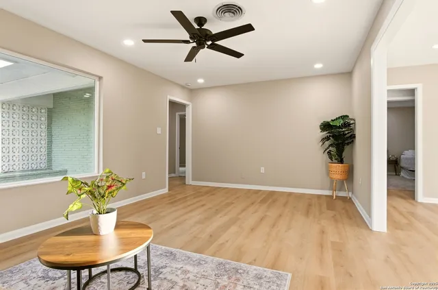 a living room with furniture and a table